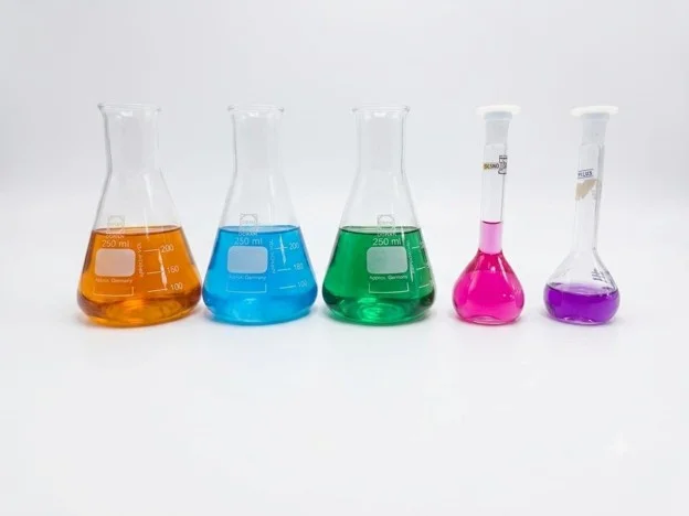 Erlenmeyer and Volumetric Flasks with Chemical Solutions